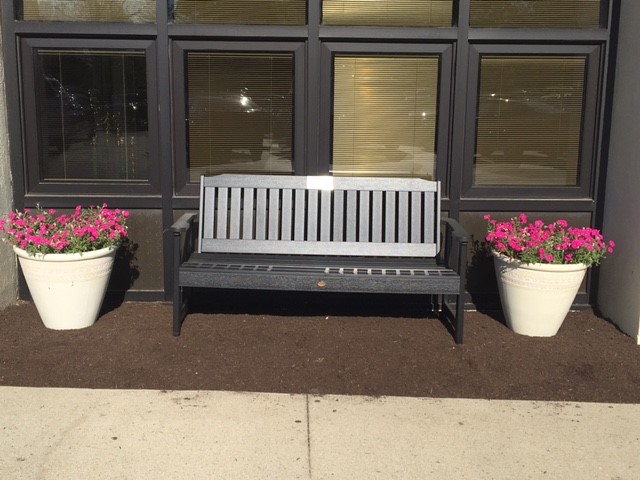 bench with two flower pots